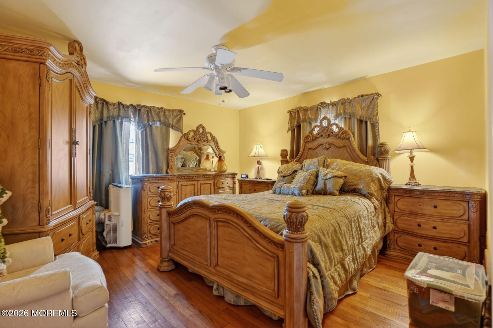 9 Hurley Street Keyport, NJ 07735 - Photo 18 of 22 a view of a bedroom with furniture and wooden floor