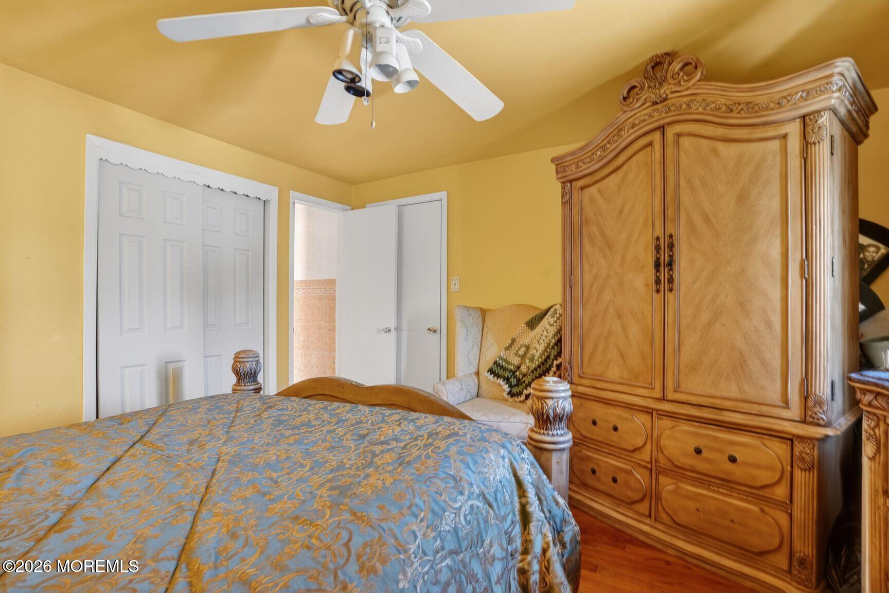 9 Hurley Street Keyport, NJ 07735 - Photo 19 of 22 a bedroom with a bed and a chandelier