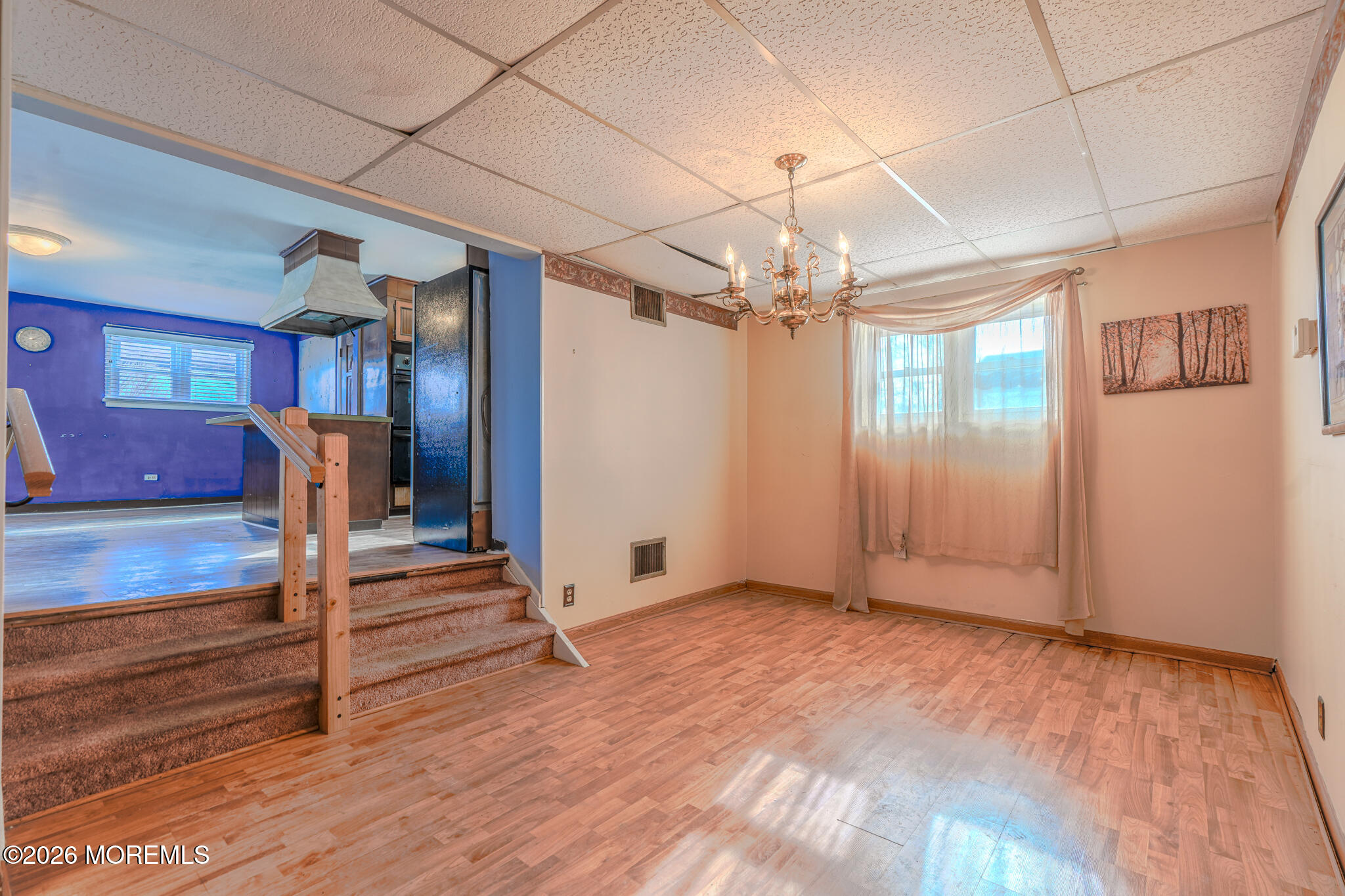 9 Hurley Street Keyport, NJ 07735 - Photo 2 of 22 a view of a room with wooden floor and ceiling fan