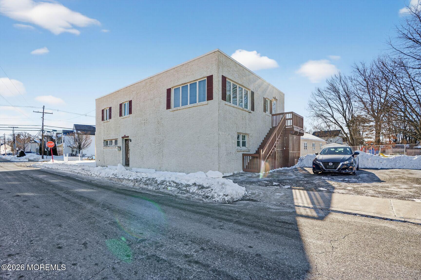 9 Hurley Street Keyport, NJ 07735 - Photo 22 of 22 a view of a house with snow on the road and covered with snow