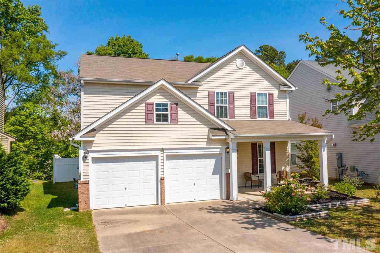 3239 Sunbright Lane Raleigh, NC 27610 - Photo 1 of 18 a front view of a house with garden