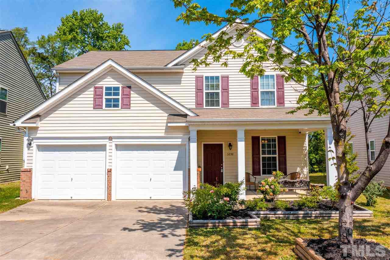 3239 Sunbright Lane Raleigh, NC 27610 - Photo 3 of 18 a view of a house with a yard and potted plants