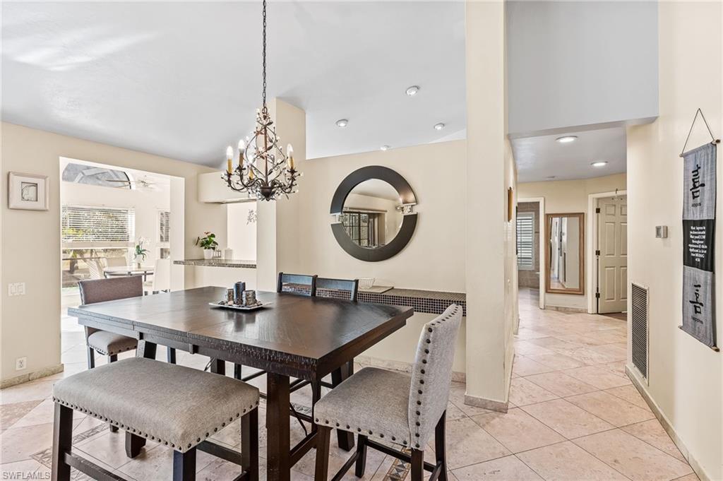 2271 Oakes Boulevard Naples, FL 34119 - Photo 11 of 47 a dining room with furniture and window