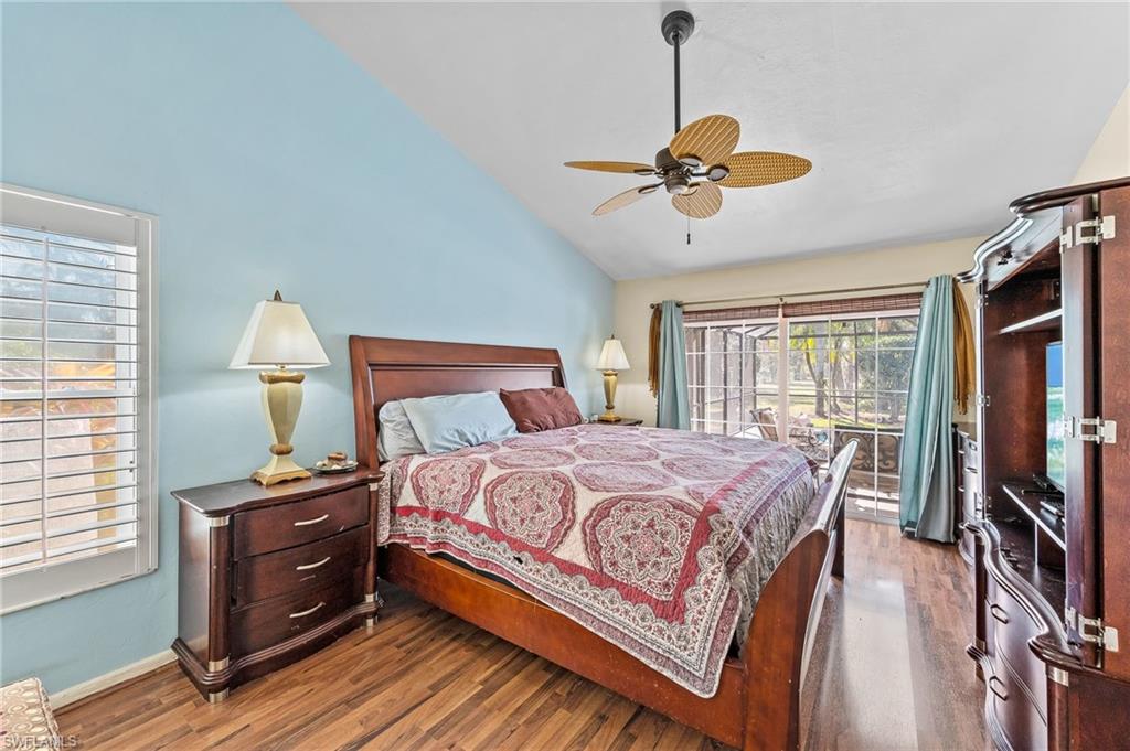 2271 Oakes Boulevard Naples, FL 34119 - Photo 20 of 47 a bedroom with a bed wooden floor and window