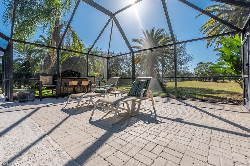 2271 Oakes Boulevard Naples, FL 34119 - Photo 39 of 47 a view of backyard with sitting area