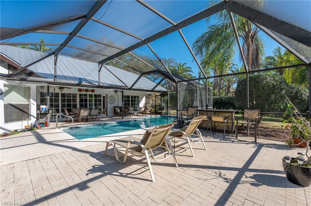 2271 Oakes Boulevard Naples, FL 34119 - Photo 40 of 47 a view of house with backyard and patio