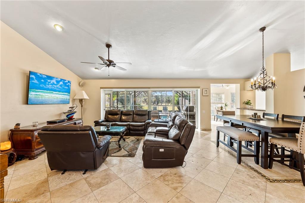2271 Oakes Boulevard Naples, FL 34119 - Photo 4 of 47 a living room with lots of furniture and a large window