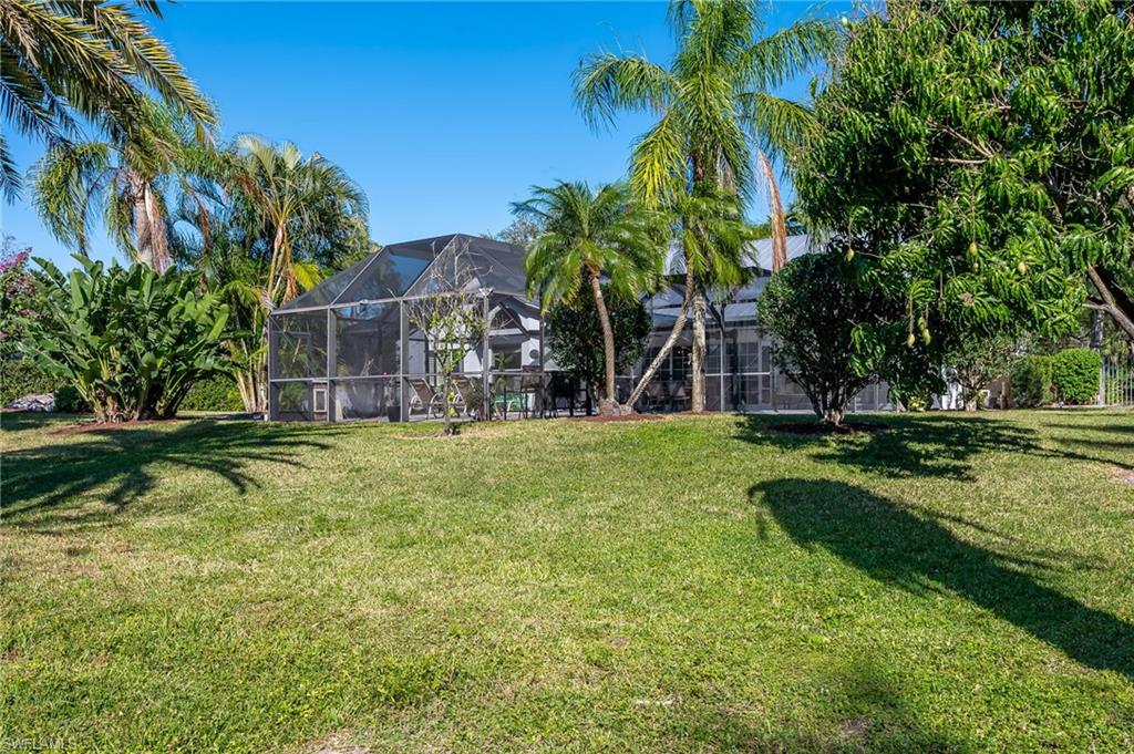 2271 Oakes Boulevard Naples, FL 34119 - Photo 43 of 47 a view of a house with a yard