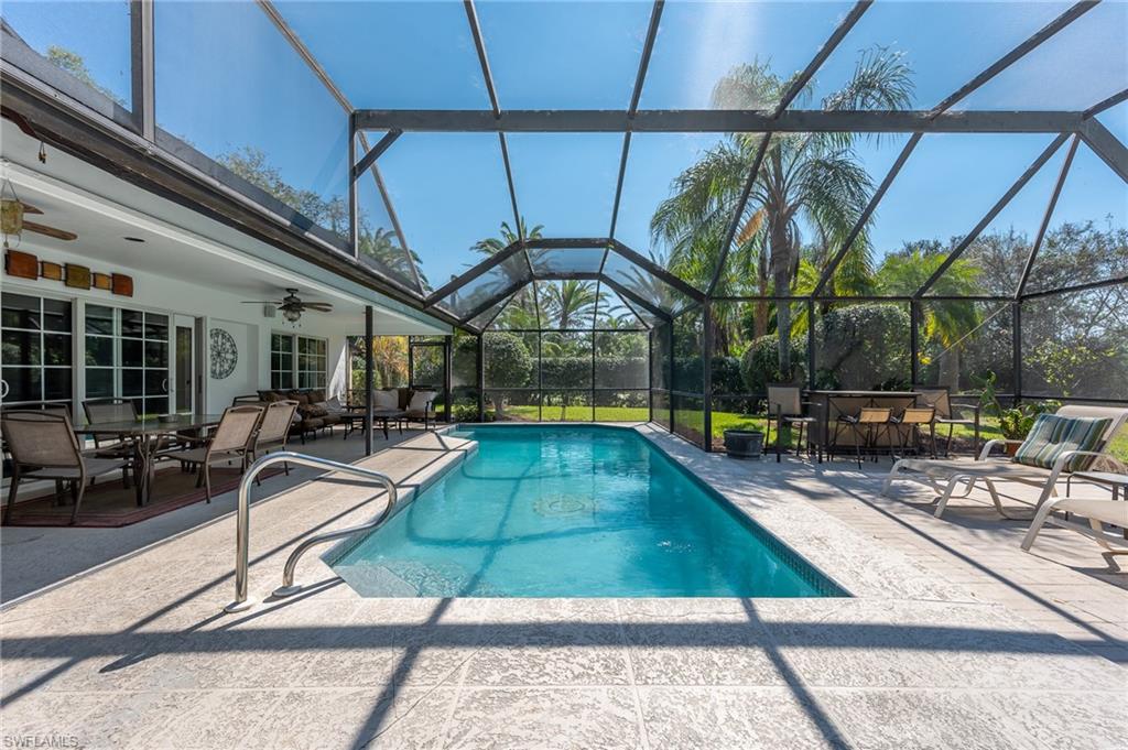 2271 Oakes Boulevard Naples, FL 34119 - Photo 45 of 47 a view of a swimming pool with a patio