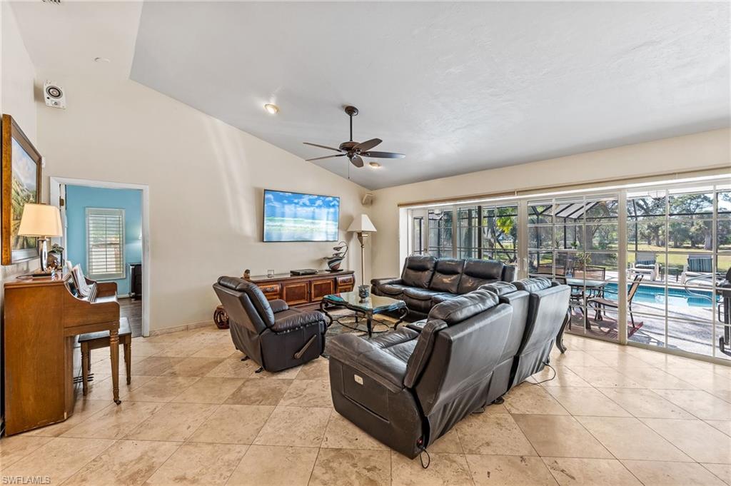 2271 Oakes Boulevard Naples, FL 34119 - Photo 5 of 47 a living room with furniture and a large window