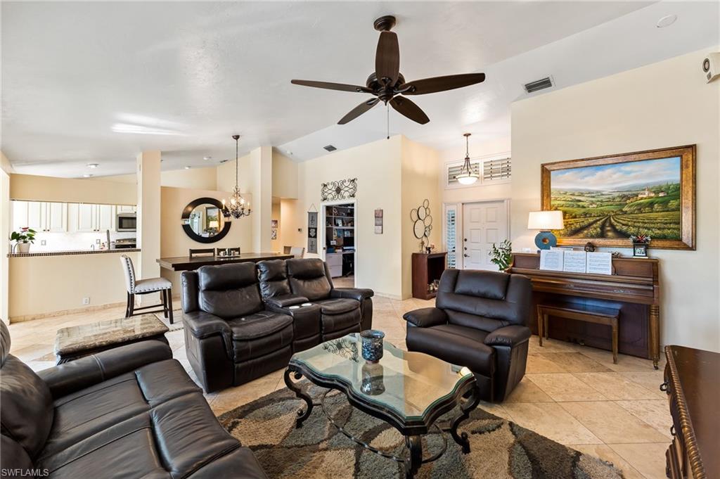 2271 Oakes Boulevard Naples, FL 34119 - Photo 8 of 47 a living room with furniture and a large window