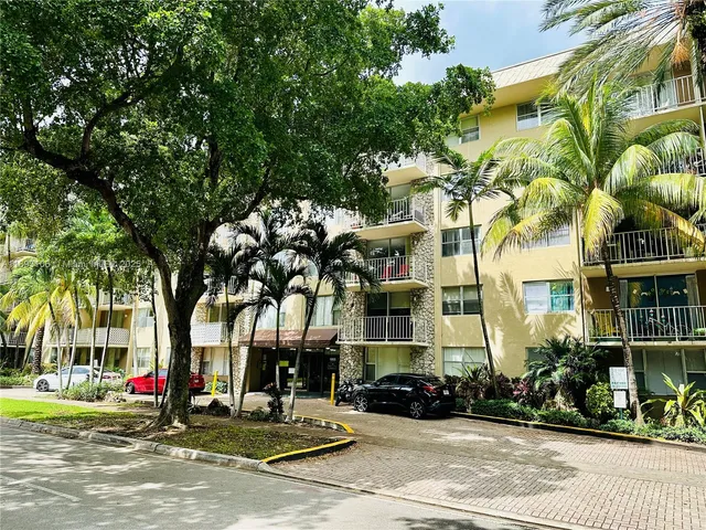 a front view of a building with street view