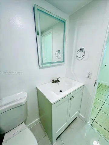 a view of a kitchen with white walls