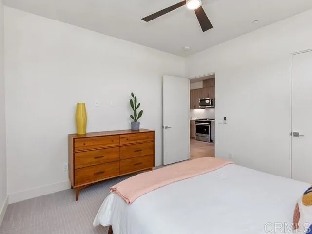 a bedroom with a bed and cabinets
