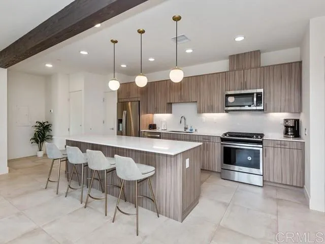 a kitchen with a sink cabinets and window