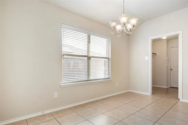 a large kitchen with stainless steel appliances lots of counter top space