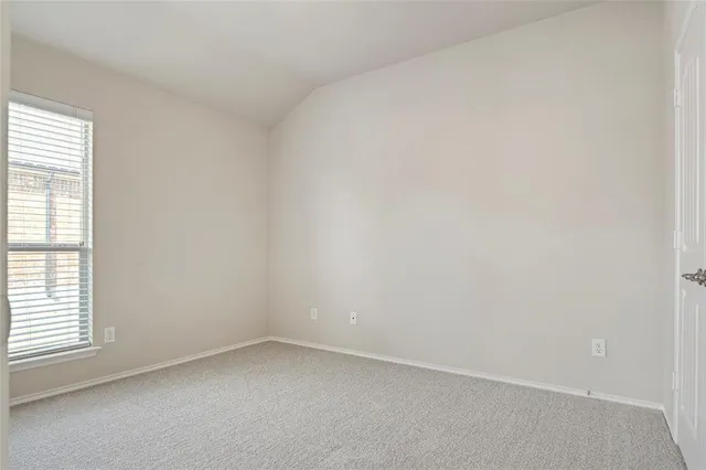 a view of backyard with tub and wooden fence