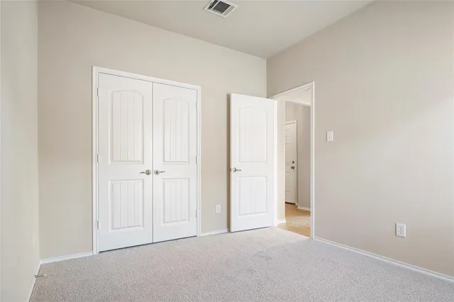 a view of a backyard with wooden fence