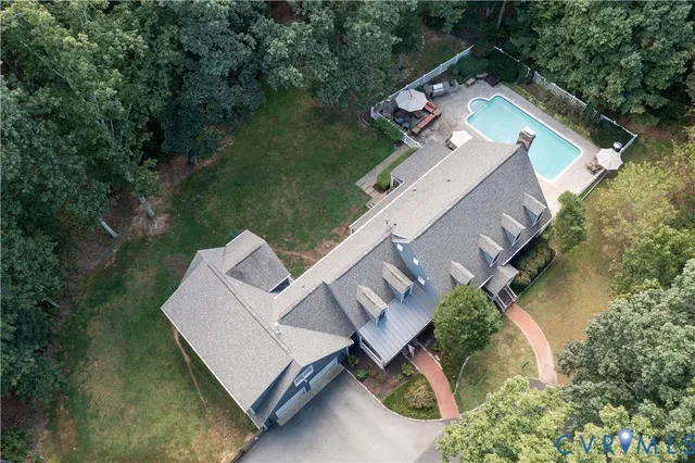 an aerial view of a house with outdoor space