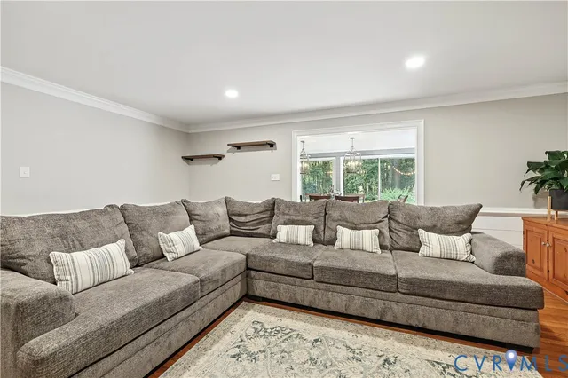 a living room with a couch and a large window