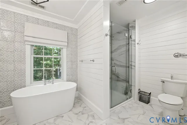 a bathroom with a bathtub and toilet