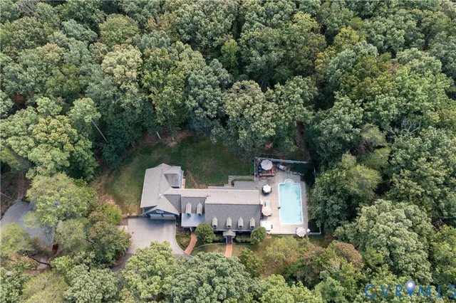 an aerial view of a house with outdoor space and street view