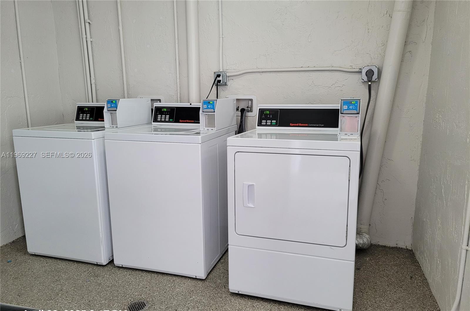 14140 Southwest 84th Street, Unit 301H Miami, FL 33183 - Photo 12 of 39 a utility room with dryer and washer