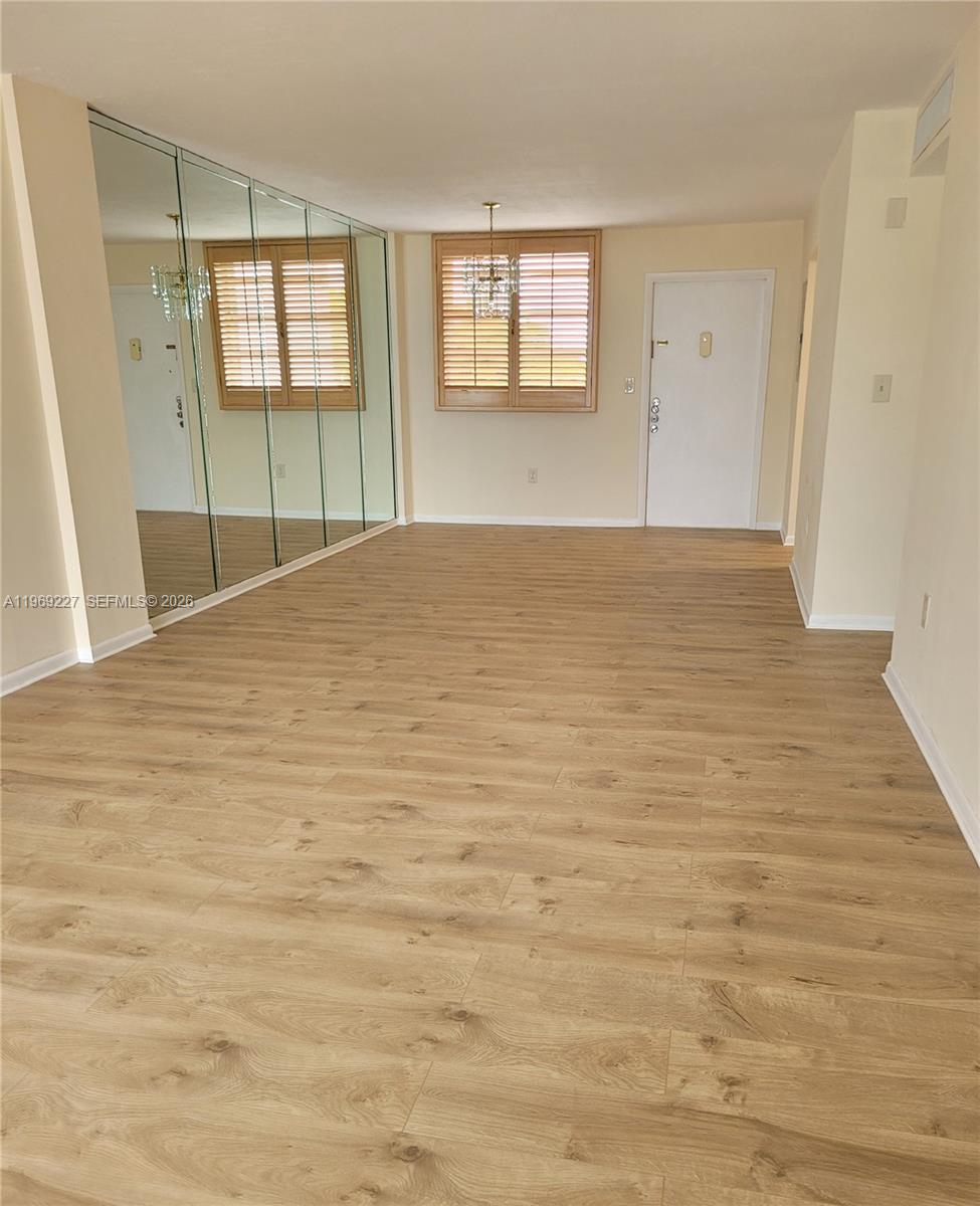 14140 Southwest 84th Street, Unit 301H Miami, FL 33183 - Photo 16 of 39 a view of empty room with wooden floor