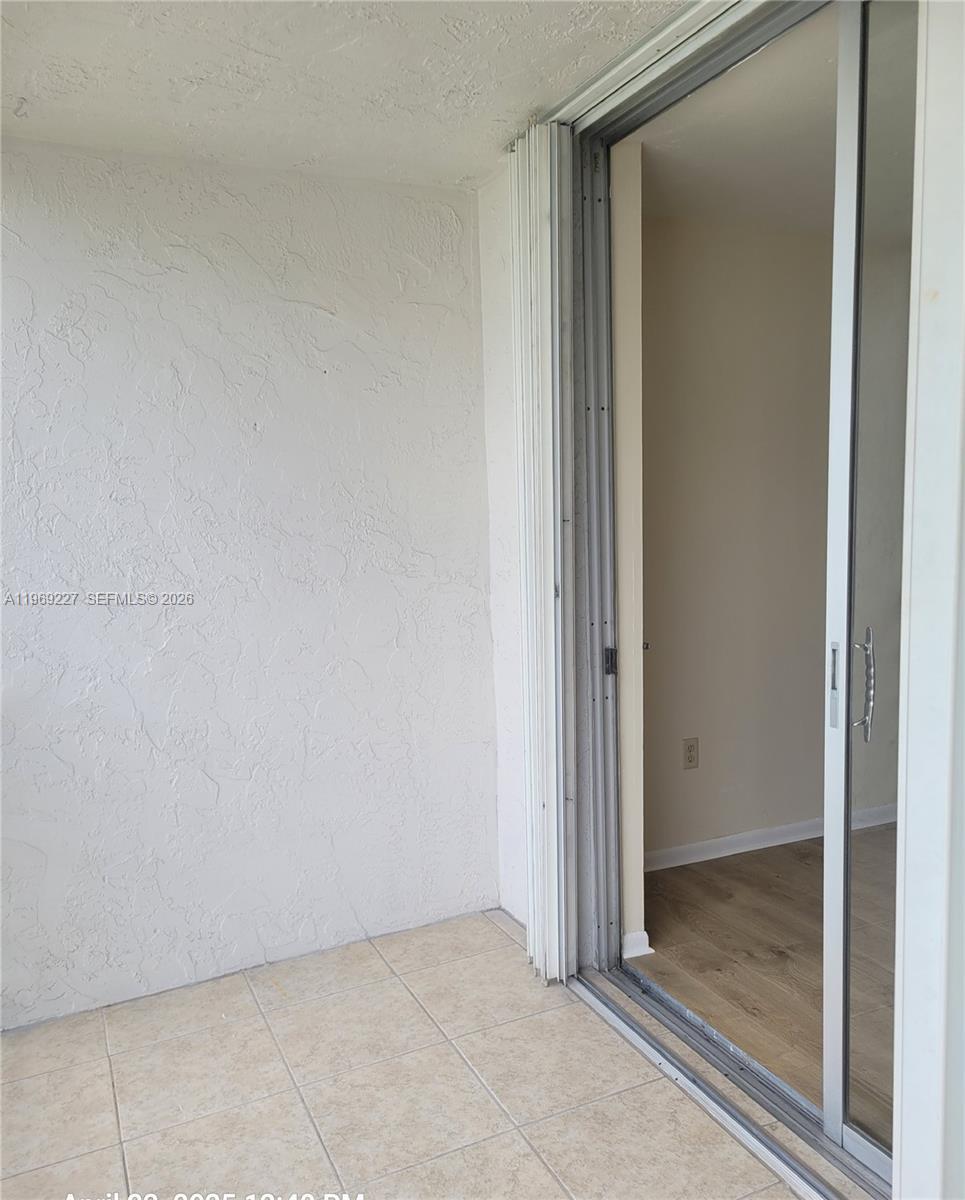 14140 Southwest 84th Street, Unit 301H Miami, FL 33183 - Photo 17 of 39 a view of an empty room