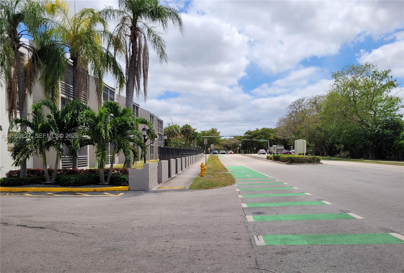 14140 Southwest 84th Street, Unit 301H Miami, FL 33183 - Photo 2 of 39 a view of swimming pool with palm trees