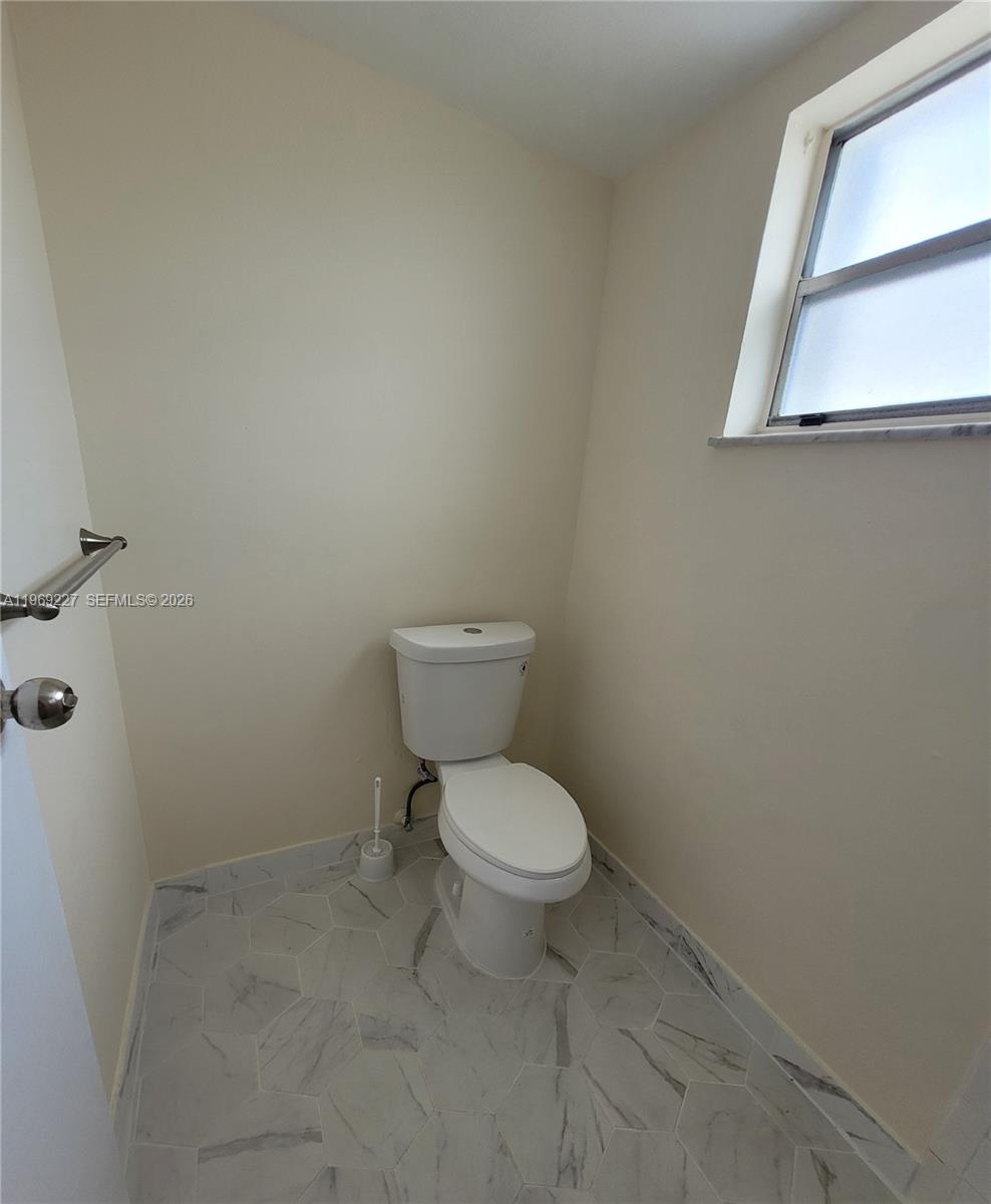 14140 Southwest 84th Street, Unit 301H Miami, FL 33183 - Photo 34 of 39 a white toilet sitting next to a white sink