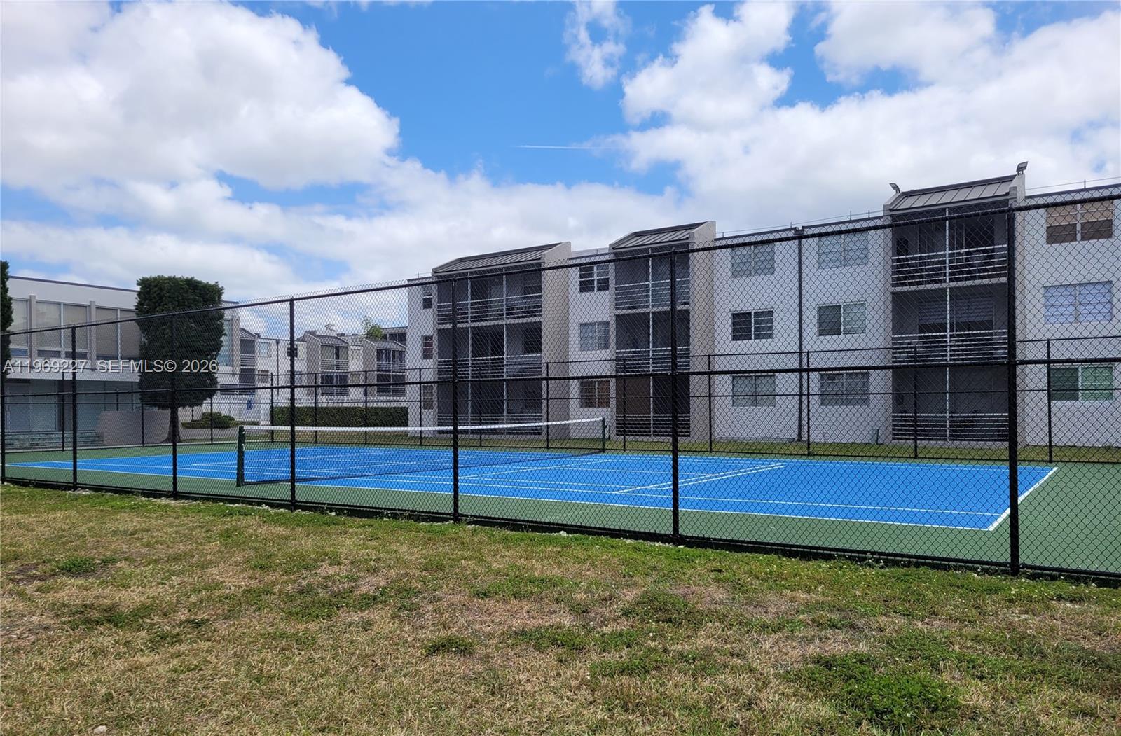 14140 Southwest 84th Street, Unit 301H Miami, FL 33183 - Photo 37 of 39 a view of a yard with an empty space and deck