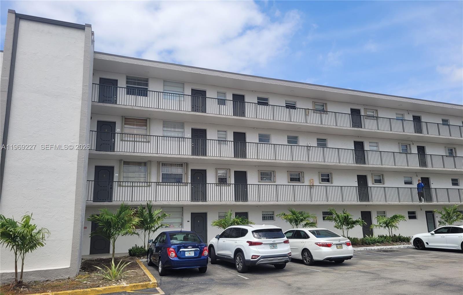 14140 Southwest 84th Street, Unit 301H Miami, FL 33183 - Photo 4 of 39 a car parked in front of a building
