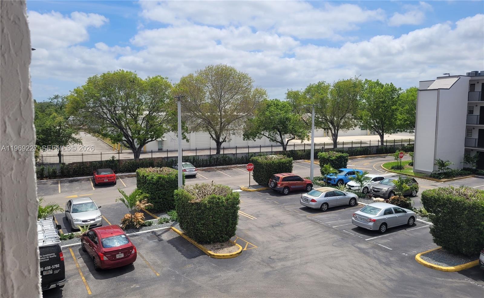 14140 Southwest 84th Street, Unit 301H Miami, FL 33183 - Photo 5 of 39 a parking space with lots of clutter and entertaining space