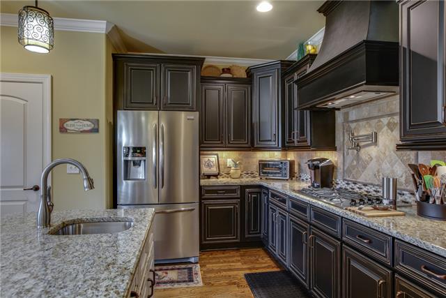 2063 Autumn Ridge Way Spring Hill, TN 37174 - Photo 8 of 20 A second view of this magnificent kitchen showcases the abundant cabinetry and workspace.