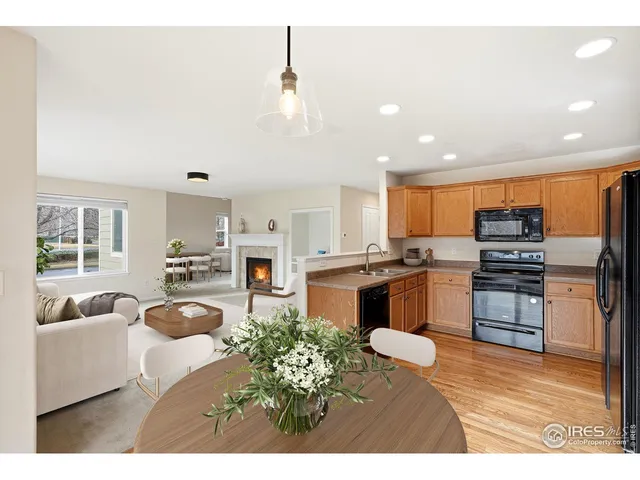 a kitchen with stainless steel appliances kitchen island granite countertop a stove a sink and a microwave