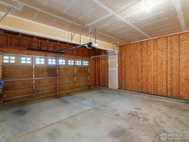 an aerial view of a house with a yard and garden