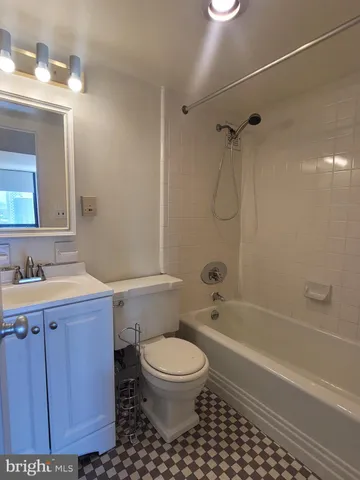a bathroom with a toilet a sink and a bathtub