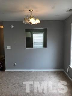 2444 Pumpkin Ridge Way Raleigh, NC 27604 - Photo 3 of 15 a view of a livingroom with a chandelier
