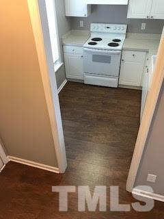 2444 Pumpkin Ridge Way Raleigh, NC 27604 - Photo 7 of 15 a view of an empty room with wooden floor