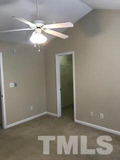 2444 Pumpkin Ridge Way Raleigh, NC 27604 - Photo 8 of 15 an empty room with a mirror and a fan