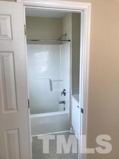 2444 Pumpkin Ridge Way Raleigh, NC 27604 - Photo 10 of 15 a bathroom with a bathtub and a shower
