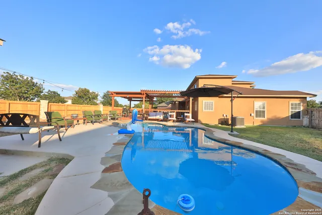 a view of a house with swimming pool