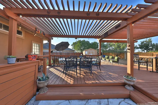 a view of a patio with a table chairs and a patio