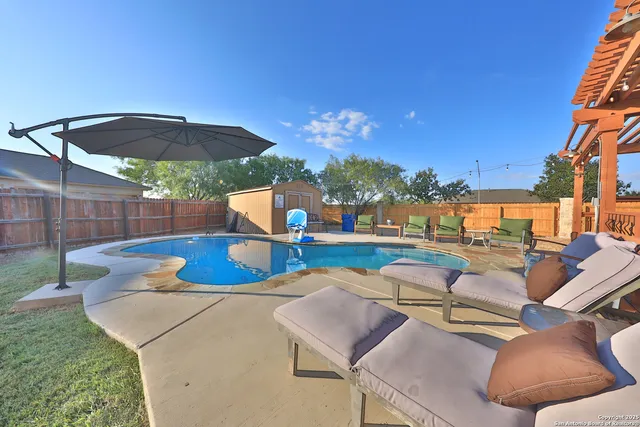 a view of a patio with swimming pool