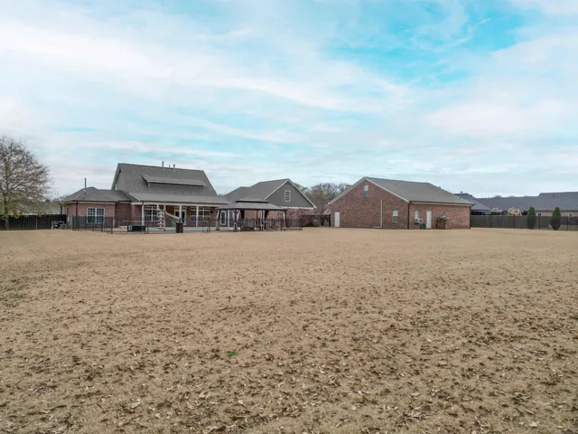 a view of houses with outdoor space and ocean view