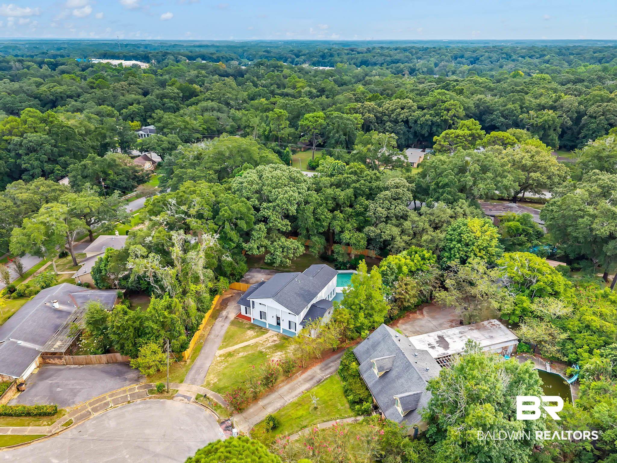 4705 Sherry Court Mobile, AL 36693 - Photo 79 of 100 Aerial view of a heavily wooded area