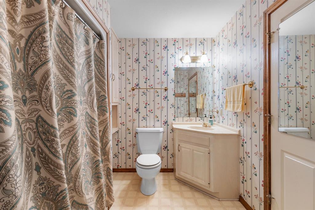 476 Private Road 7326 Emory, TX 75440 - Photo 28 of 33 a bathroom with a toilet sink and mirror