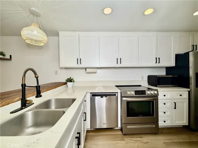 a kitchen with a stove and a sink