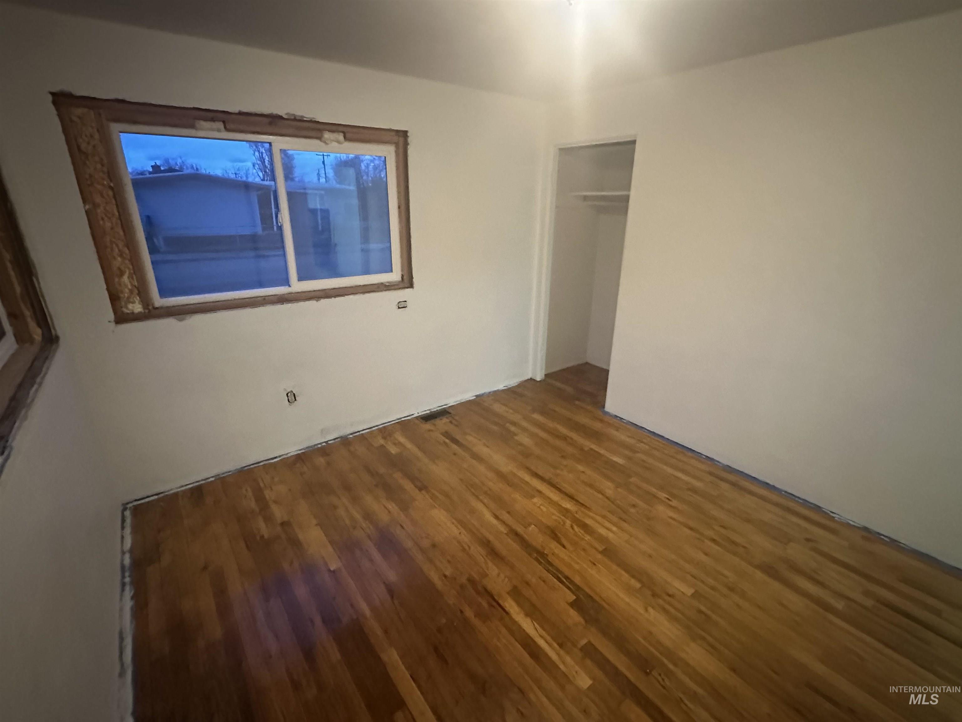 410 South Yakima Street Vale, OR 97918 - Photo 19 of 29 Unfurnished bedroom with wood finished floors and a closet
